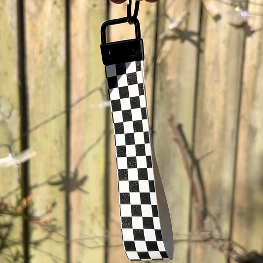 Black and white checkered wristlet with black metal hardware