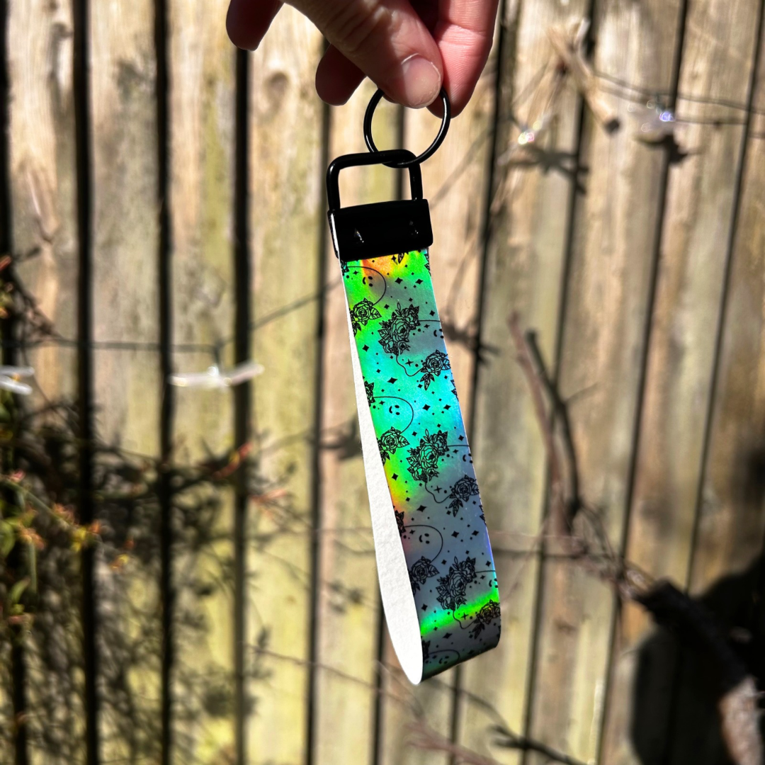 Holographic ghost and flower wristlet 